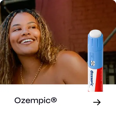 Woman smiling with a pen of Ozempic